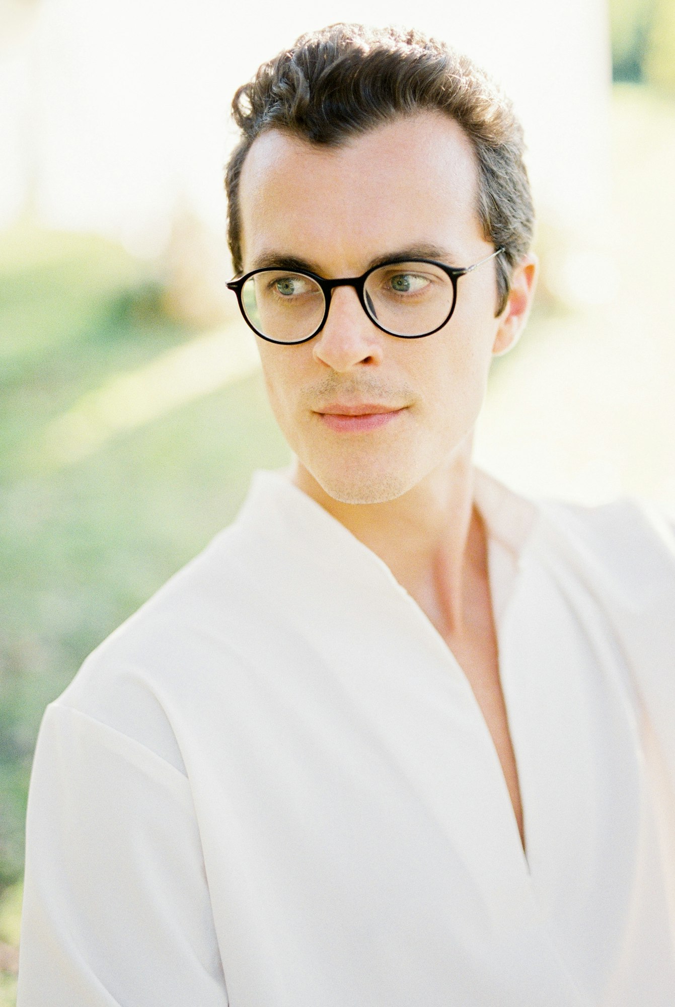 Portrait in profile of a man in a white shirt